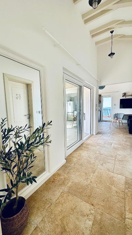 Hallway with sliding doors onto the sea-view terrace in Endless Summer