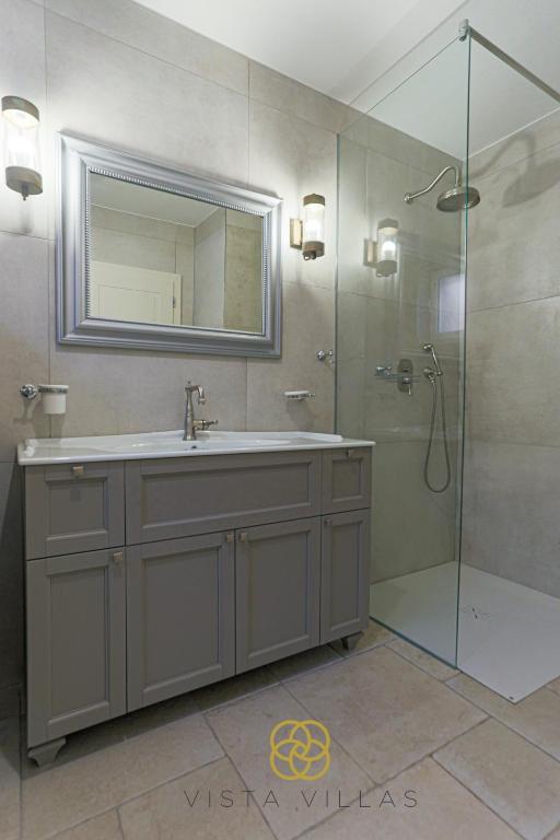 Bathroom with glass shower at Salty Kisses, Villa S