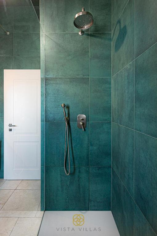 Rain shower against deep green tiles at Sweet Life, Villa S